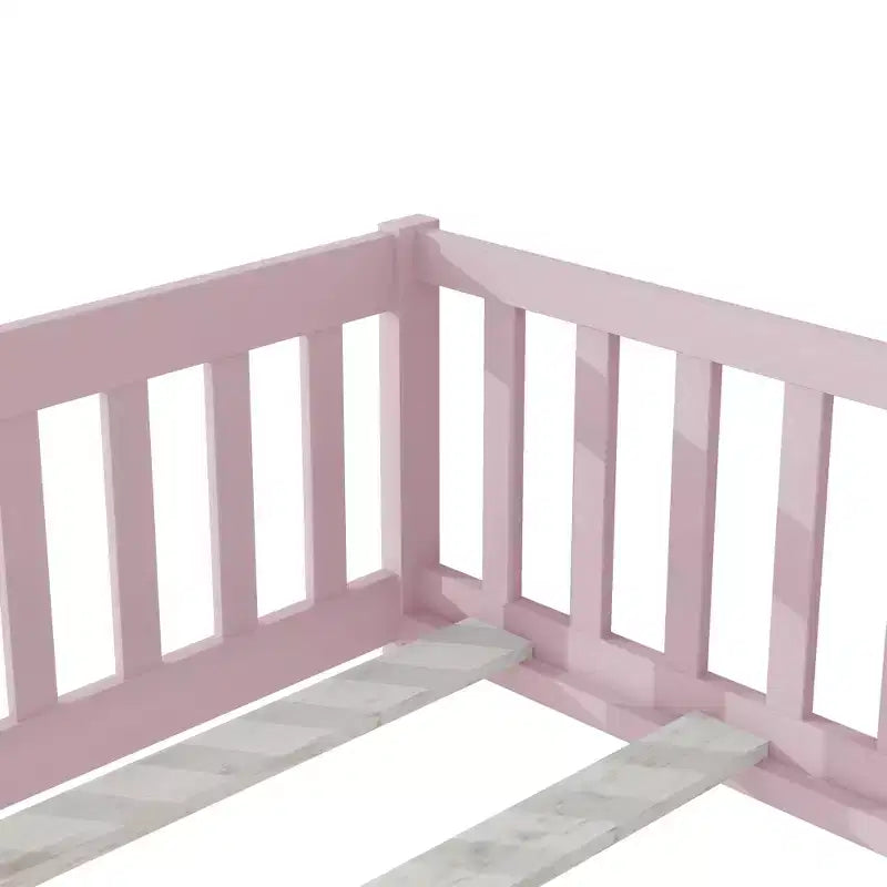 Cama individual de plataforma baja rosa con barandillas
